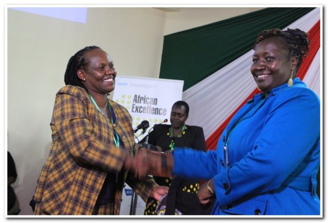 director nairobi campus presenting a gift to prof.korir